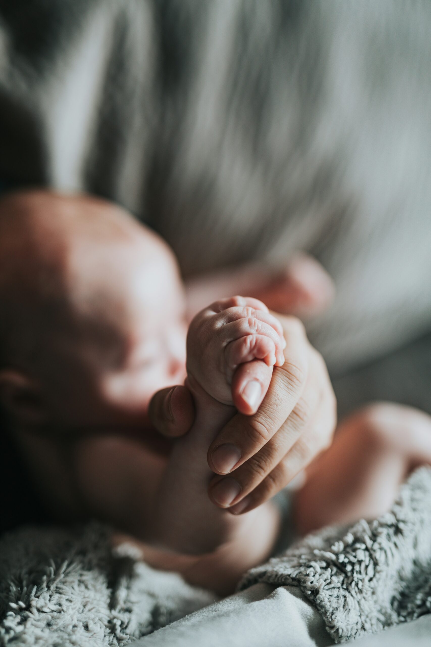 baby holding a hand
